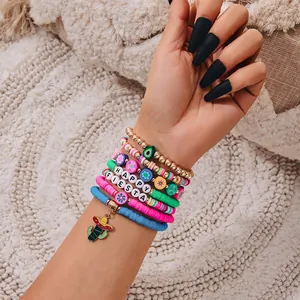 Detailed shot of a colorful Fiesta clay bead bracelet stack featuring a cactus charm