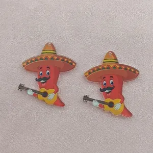 Detailed view of Mexican fiesta acrylic chili pepper charms with sombrero and guitar design