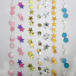 Detailed macro view of colorful star and circle paper garlands for festive party decor