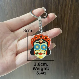 Detailed view of Mexican sugar skull keychain with dimensions 3x2.8cm and 6.4g weight