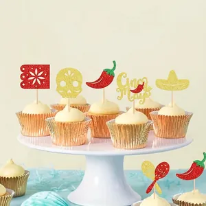Detailed macro shot of glittery Mexican-themed cupcake toppers featuring chili and skulls