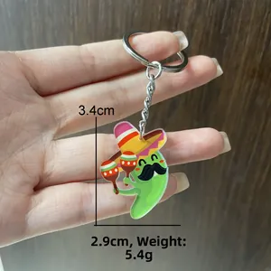 Close-up of Mexican Carnival cartoon keychain showing 3.4x2.9cm size and 5.4g weight.