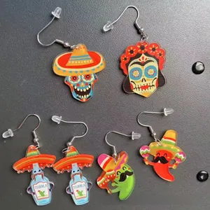 Detailed showcase of colorful Mexican Fiesta acrylic earrings featuring skull and tequila designs