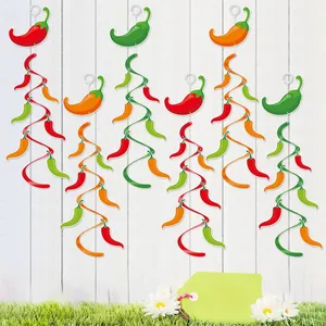 Colorful Mexican party chili spiral hanging ornaments displayed against white wooden fence.