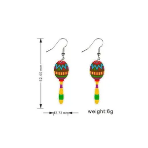 Detailed view of Mexican maraca acrylic earrings showing 62.40mm height and 6g weight