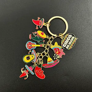 Detailed view of Mexican carnival keychain with colorful chili and avocado enamel charms