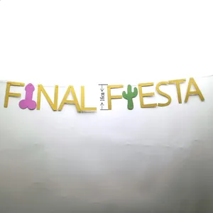 Close-up detail of a golden glitter Final Fiesta party banner with cactus and penis icons