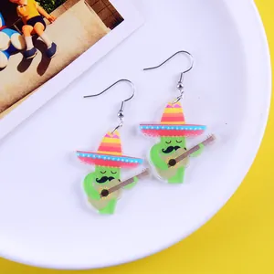 Close-up of Mexican fiesta cactus earrings with sombrero and guitar detail.
