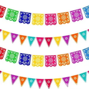 Multiple rows of colorful Mexican felt banners with intricate cutouts for party decor