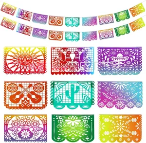 Detail view of various gradient Mexican papel picado banners with traditional folk patterns