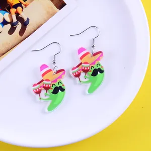 Detailed view of Mexican fiesta cartoon earrings with sombrero and maracas design
