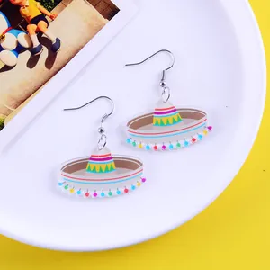 Detailed macro view of colorful Mexican sombrero acrylic earrings for carnival party