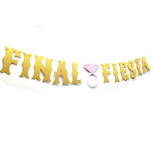 Gold glitter Final Fiesta bachelorette party banner with diamond ring decoration.