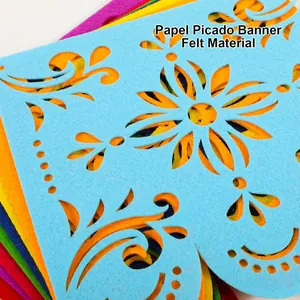 Macro detail of laser-cut Mexican Papel Picado banner made of durable colorful felt