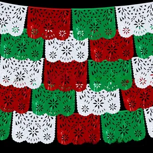 Detailed view of red, white, and green Mexican Papel Picado banners for party decor