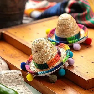 Mini Mexican straw sombrero hair clip with colorful pom-poms for festive fiesta party decor