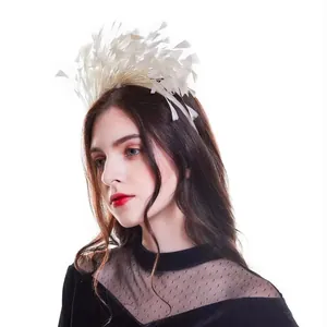 Close-up of white feather headband worn by a model for masquerade party outfits