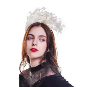 Close-up of elegant white feather headband for masquerade party and carnival