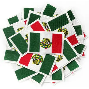 Pile of Mexico flag embroidered patches with detailed eagle emblem and white borders
