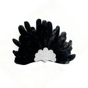 Macro detail of elegant black feather headband featuring a sparkling crystal fan motif