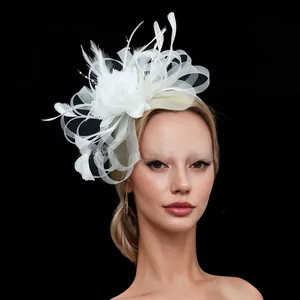 Elegant white mesh and feather fascinator headband for bridal weddings and formal banquets