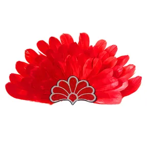 Detailed view of the vibrant red feathers and sequined base of this festival headband