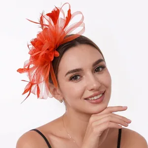 Elegant orange mesh and feather fascinator headpiece for party or wedding