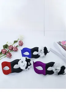 Detailed view of Halloween masquerade masks with glitter finish and skull flower accents