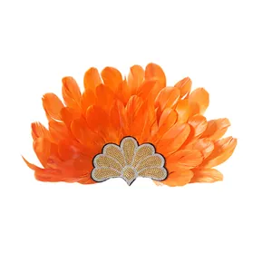 Detailed close-up view of a vibrant orange feather carnival headpiece with sequins