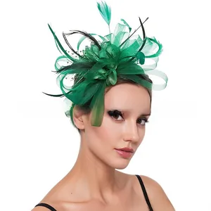 Detailed close-up of emerald green mesh fascinator headband with elegant feather accents