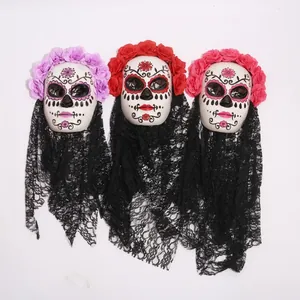 Three Mexican Day of the Dead masks with flower headbands and black lace veils