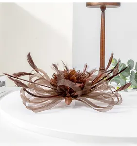 Elegant brown mesh fascinator with decorative feathers for wedding and formal party