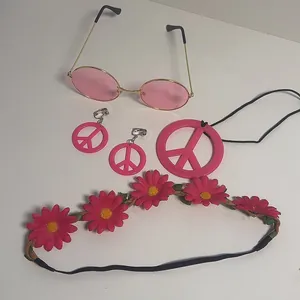 Pink hippie accessory set including sunglasses, peace necklace, earrings, and headband