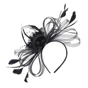 Detailed macro view of black mesh fascinator headband with elegant feathers and beads.