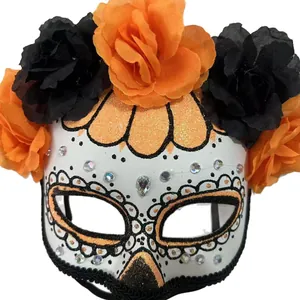 Day of the Dead sugar skull mask with vibrant black and orange artificial flowers