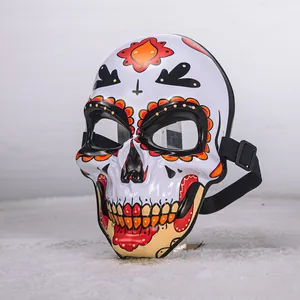 Detailed macro view of hand-painted Day of the Dead resin skull mask for cosplay parties.
