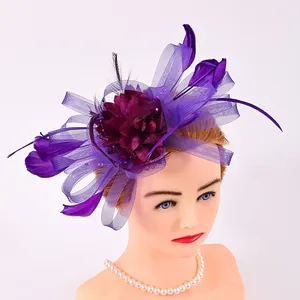 Close-up of elegant purple mesh fascinator headpiece with feathers and flowers