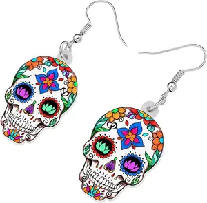 Detail of colorful sugar skull acrylic earrings with floral patterns for Halloween gift