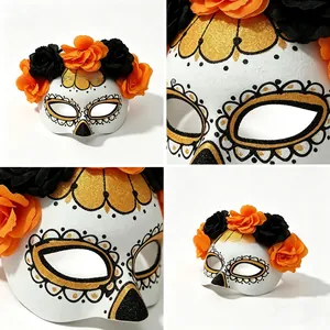 Detailed views of Day of the Dead mask with orange flowers and gold glitter accents