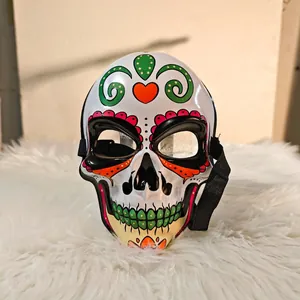 Detailed view of resin Day of the Dead skull mask with colorful painted patterns