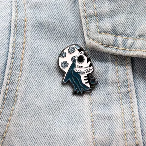 Close-up detail of a blue sugar skull skater girl enamel pin on denim fabric