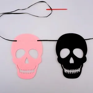 Halloween felt skull garland banner DIY decoration kit with pink and black skull cutouts