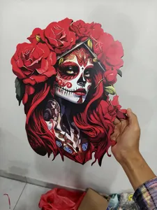 Detail shot of a wooden Halloween hanging sign with a Sugar Skull woman and red roses