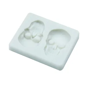 Close-up detail of white silicone skull mold for Halloween fondant decoration and chocolate