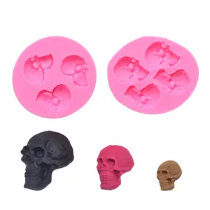 Detailed view of pink skull silicone molds showing finished black, pink and brown samples