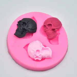 Close-up detail of a professional pink skull silicone mold for DIY baking crafts