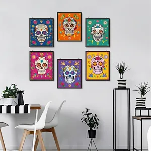 Set of six Day of the Dead sugar skull wall art pieces displayed in a modern dining area