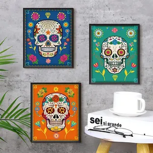 Vibrant Day of the Dead sugar skull floral wall art prints in black frames on gray wall