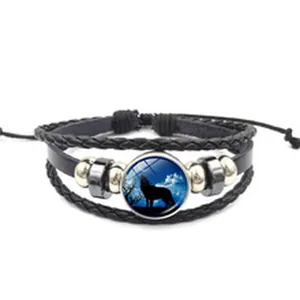 Bracelet vintage minimaliste en cuir tressé multicouche avec cabochon de loup hurlant
