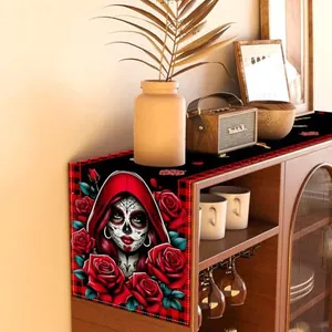 Detailed view of the Day of the Dead sugar skull table runner featuring vibrant red roses.